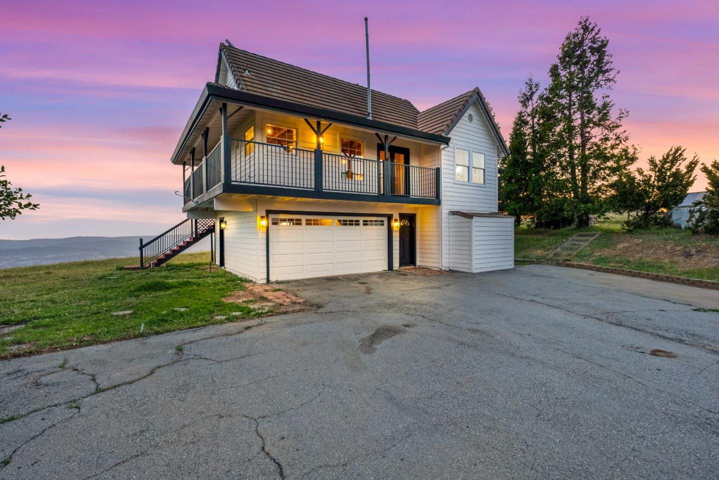 16505 Finley Ridge Road Morgan Hill, CA 95037 - Photo 3 of 44 a front view of a house with a yard and garage