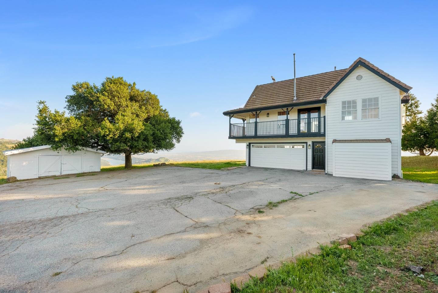 16505 Finley Ridge Road Morgan Hill, CA 95037 - Photo 32 of 44 a view of a house with a yard and a garage