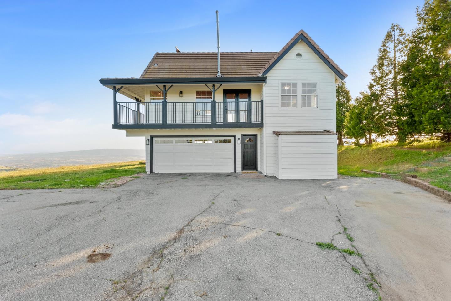 16505 Finley Ridge Road Morgan Hill, CA 95037 - Photo 33 of 44 a view of a house with a yard and garage