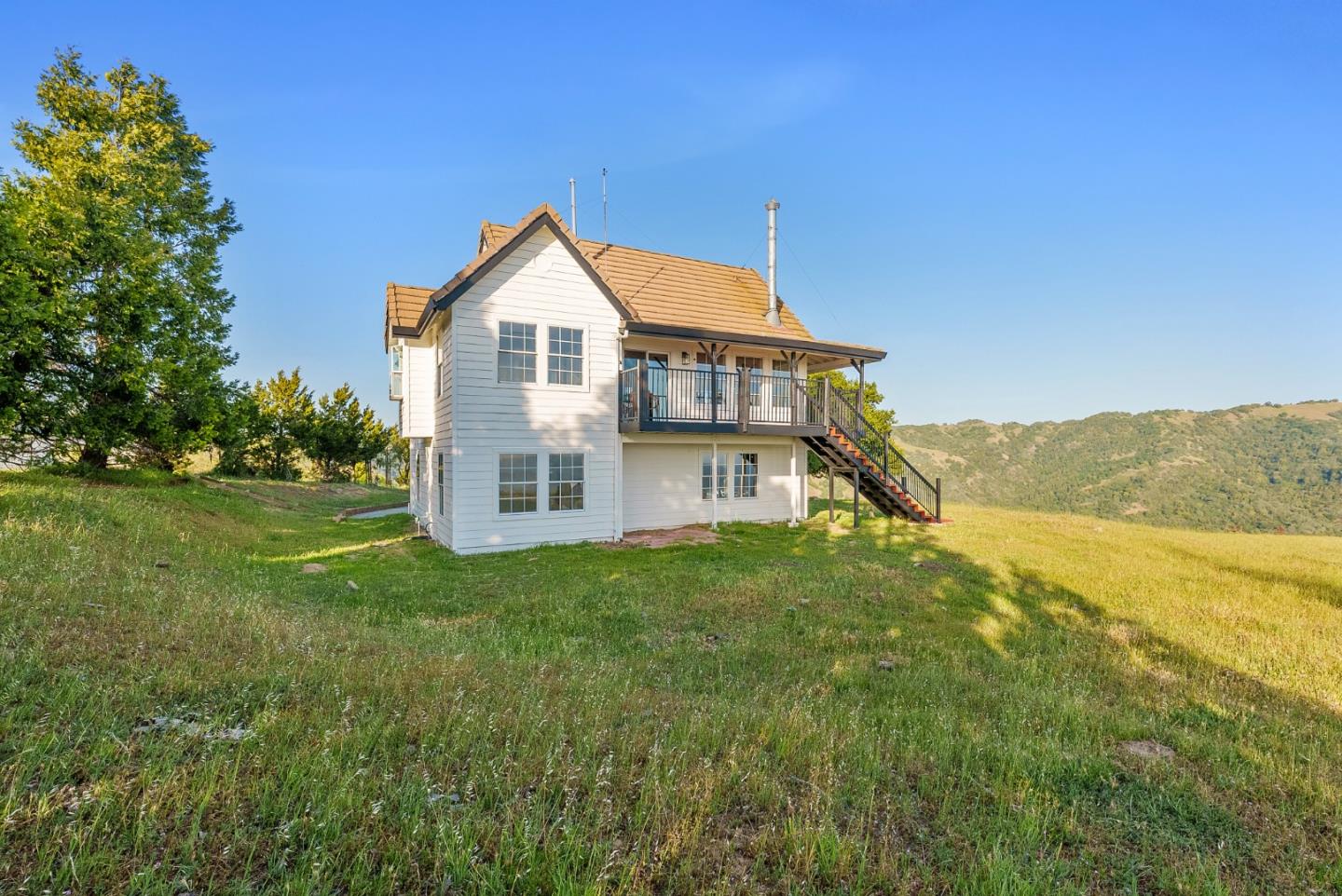 16505 Finley Ridge Road Morgan Hill, CA 95037 - Photo 36 of 44 a view of a big house with a big yard and large trees
