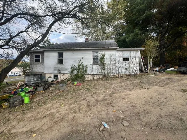 a house with trees in the background