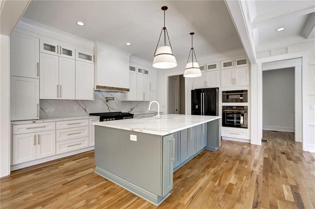 6113 Deepwater Cove Gainesville, GA 30506 - Photo 12 of 82 a kitchen with a stove a sink and a refrigerator