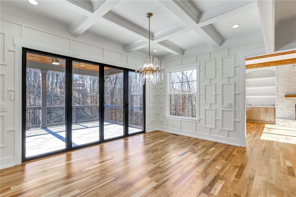 6113 Deepwater Cove Gainesville, GA 30506 - Photo 21 of 82 a view of an empty room with glass door and windows