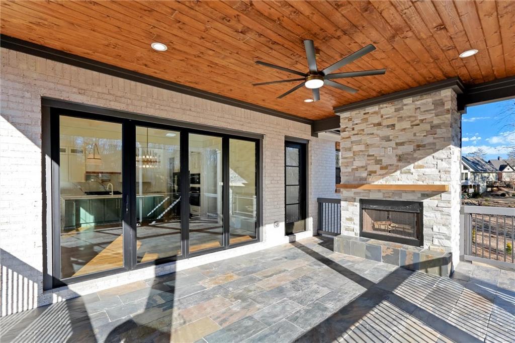 6113 Deepwater Cove Gainesville, GA 30506 - Photo 22 of 82 a living room with furniture a fireplace and a table