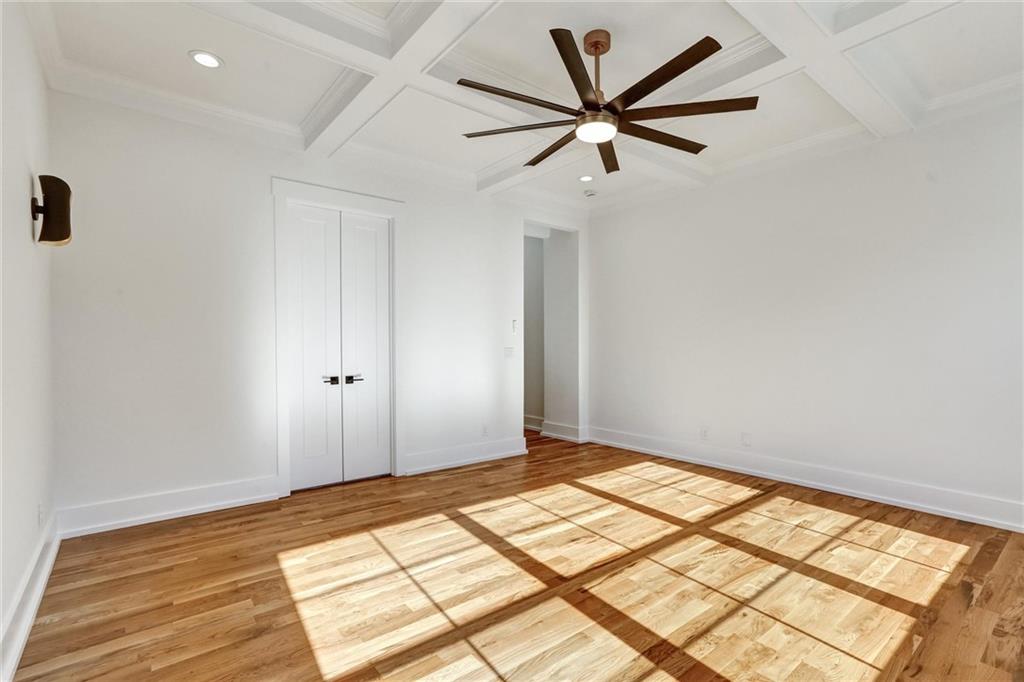 6113 Deepwater Cove Gainesville, GA 30506 - Photo 25 of 82 a view of a big room with wooden floor and a ceiling fan