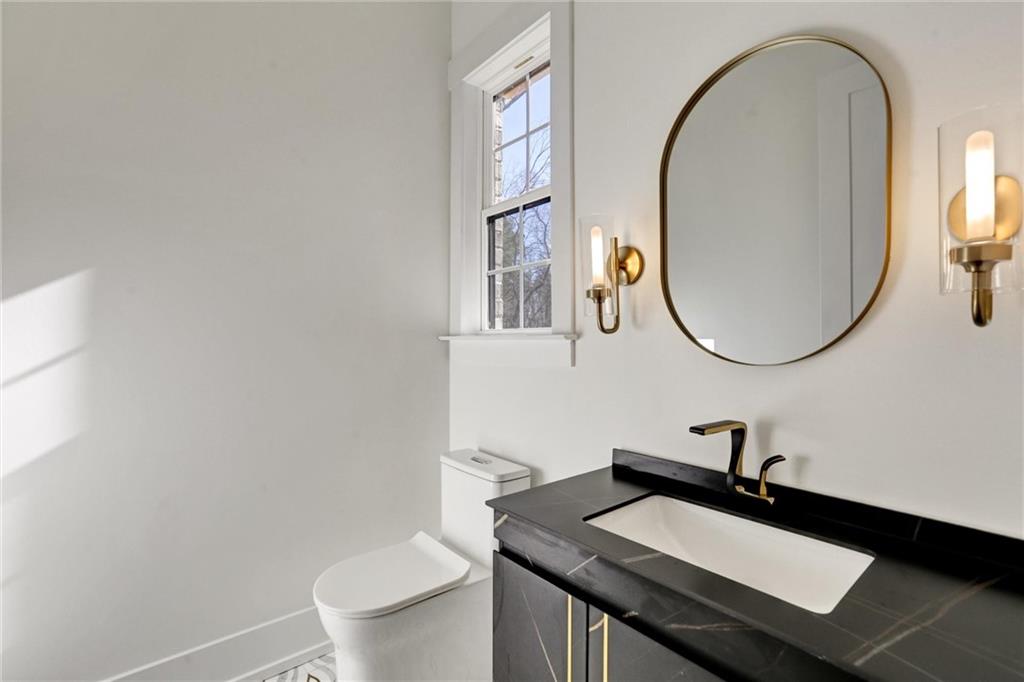 6113 Deepwater Cove Gainesville, GA 30506 - Photo 34 of 82 a bathroom with a sink and a mirror