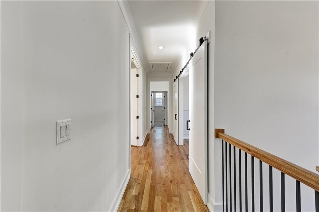 6113 Deepwater Cove Gainesville, GA 30506 - Photo 39 of 82 a view of a hallway with wooden floor