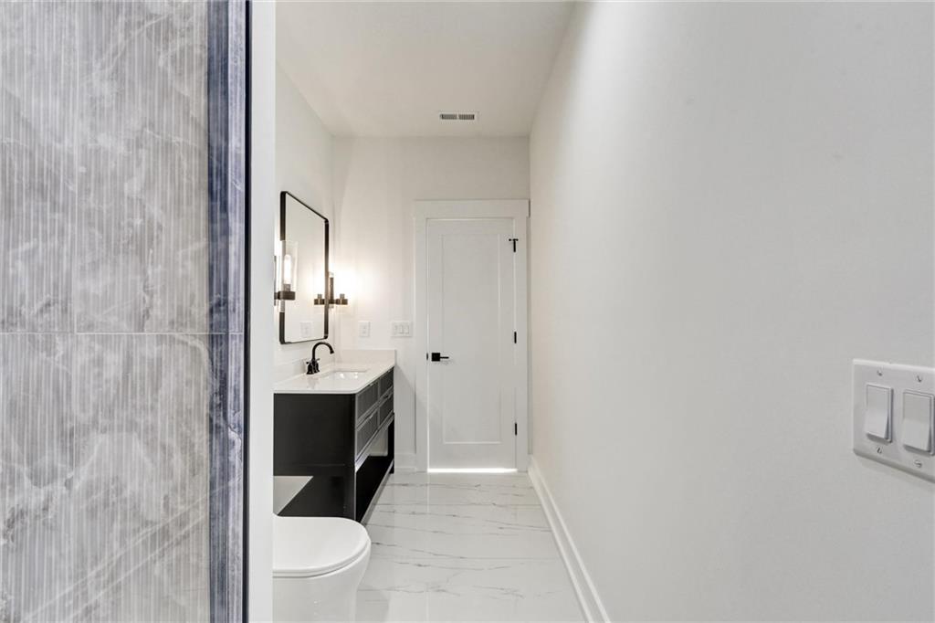 6113 Deepwater Cove Gainesville, GA 30506 - Photo 53 of 82 a bathroom with a sink and a mirror