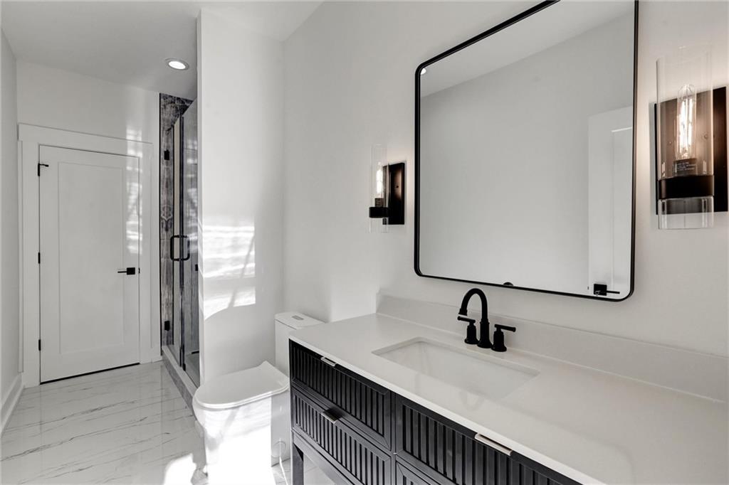 6113 Deepwater Cove Gainesville, GA 30506 - Photo 55 of 82 a bathroom with a sink and a mirror