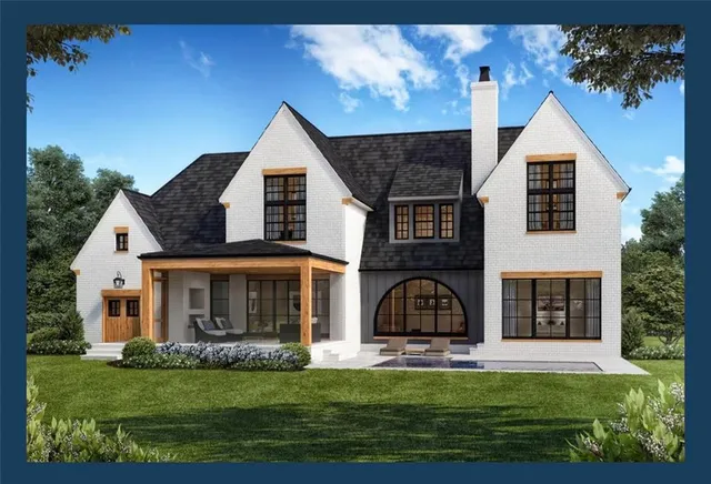 a front view of a house with a garden and plants