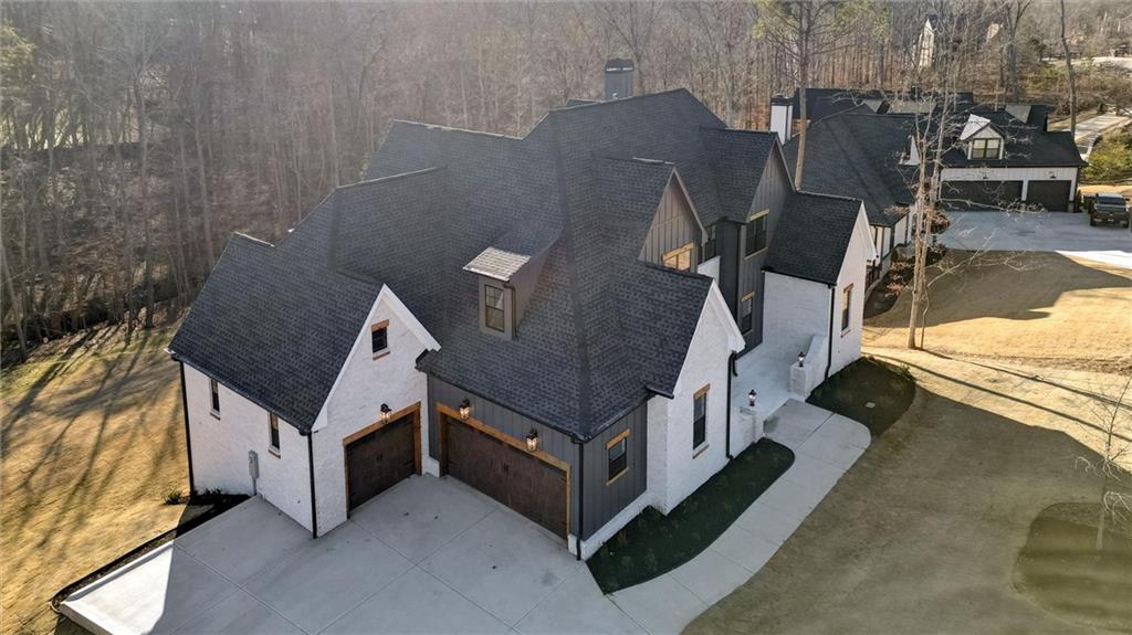 6113 Deepwater Cove Gainesville, GA 30506 - Photo 73 of 82 a view of a house with backyard and sitting area