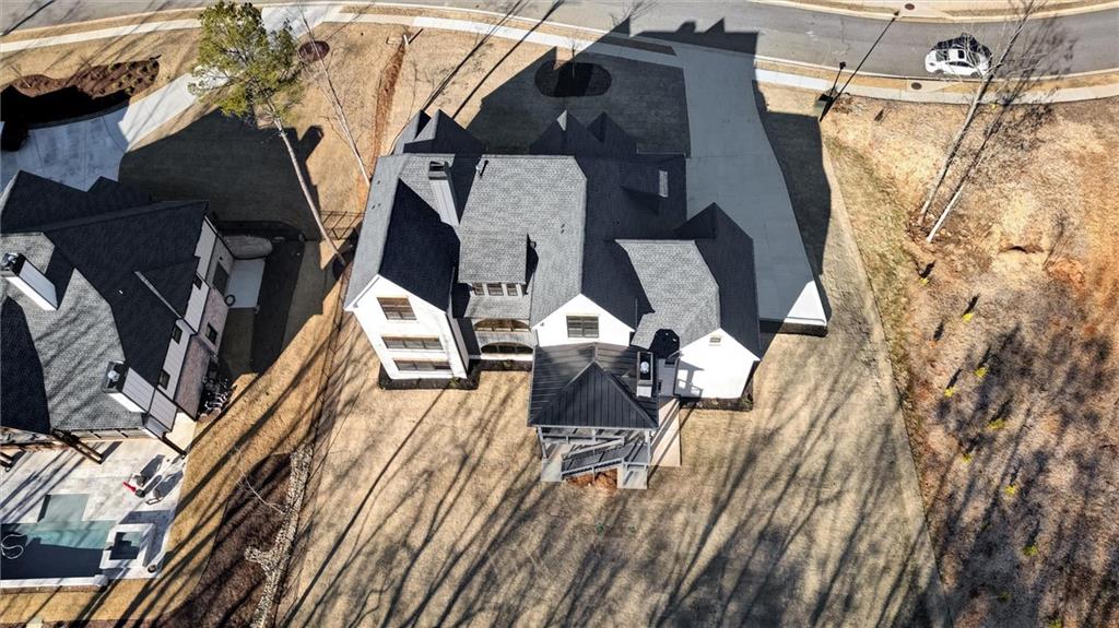 6113 Deepwater Cove Gainesville, GA 30506 - Photo 78 of 82 a view of walk in closet with clothes and shoes