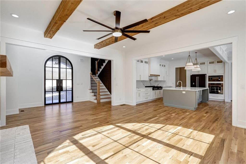 6113 Deepwater Cove Gainesville, GA 30506 - Photo 8 of 82 a view of a kitchen with furniture and wooden floor