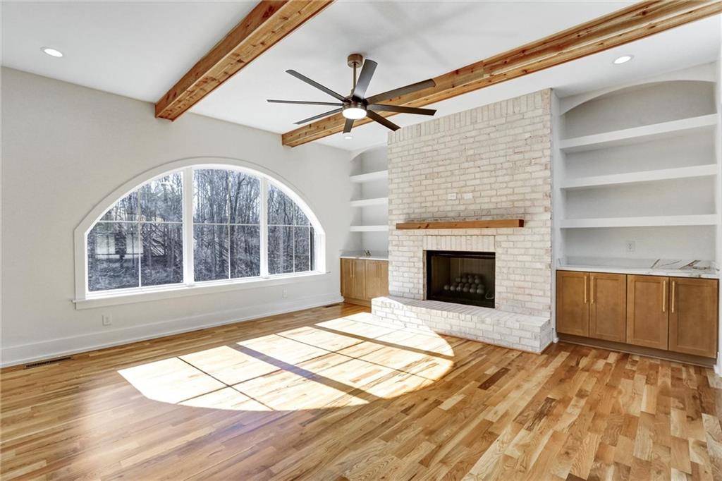 6113 Deepwater Cove Gainesville, GA 30506 - Photo 10 of 82 a view of an empty room with a fireplace and a window