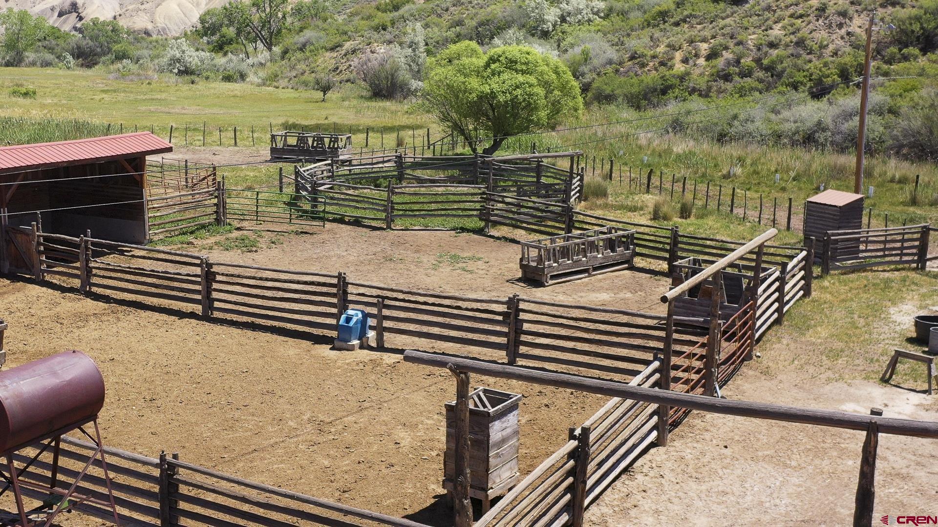 11694 Trap Club Road Austin, CO 81410 - Photo 12 of 45 a view of a patio with two chairs and a table