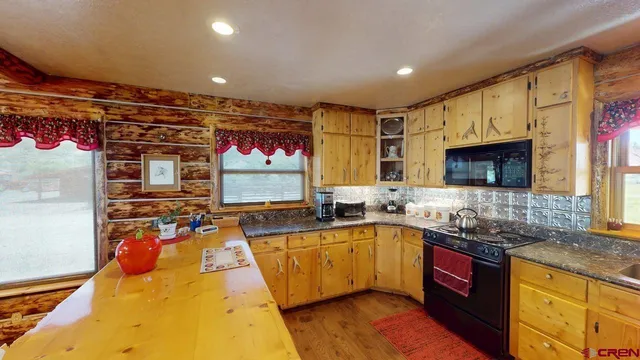 a kitchen with lots of counter top space and a sink