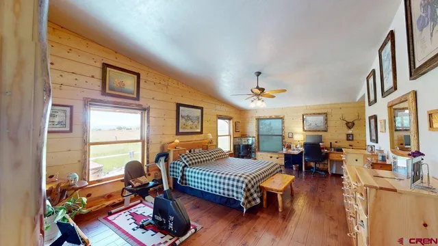 a living room with furniture a wooden floor and a window