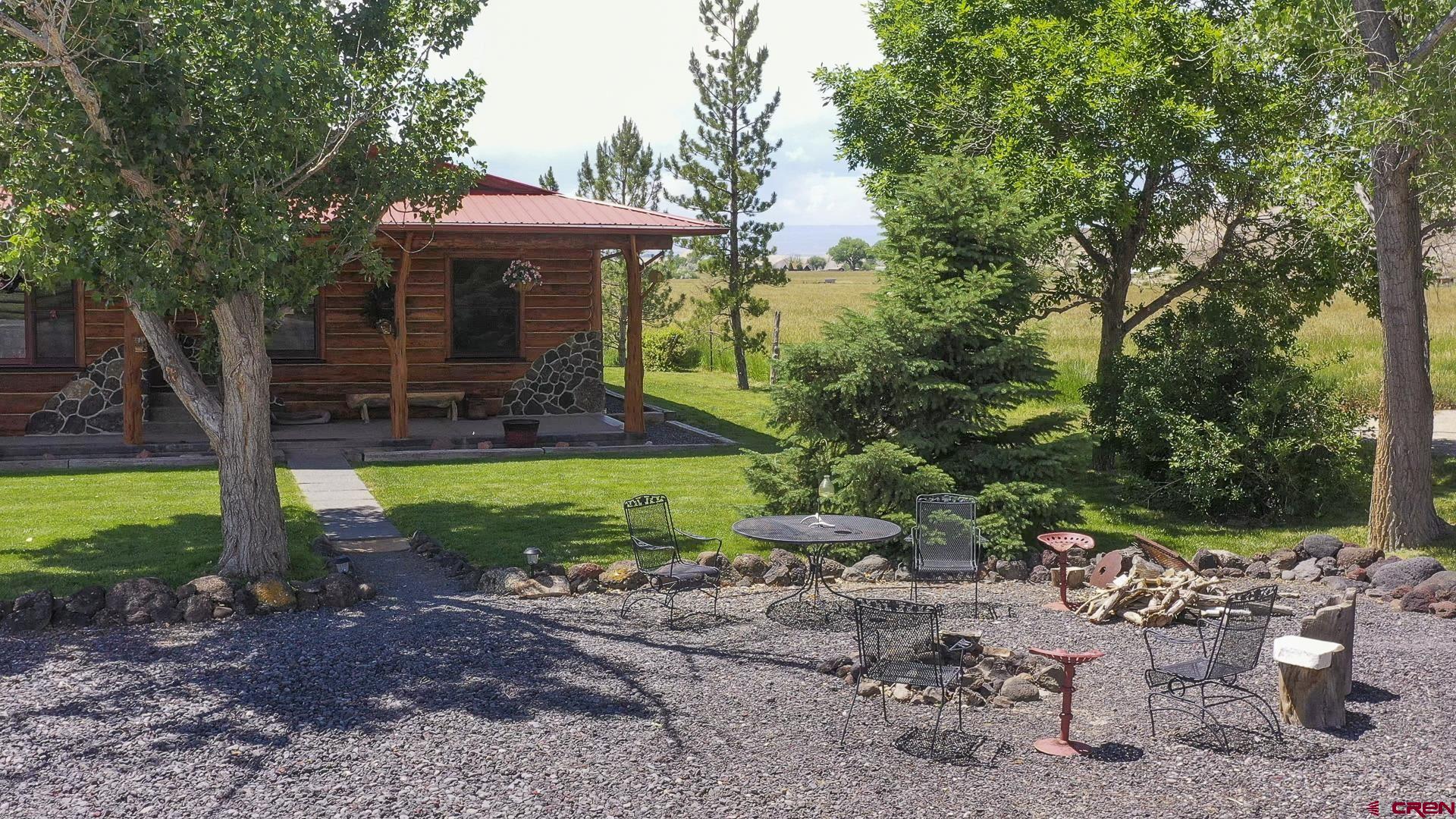 11694 Trap Club Road Austin, CO 81410 - Photo 17 of 45 a view of a patio with chairs and plants