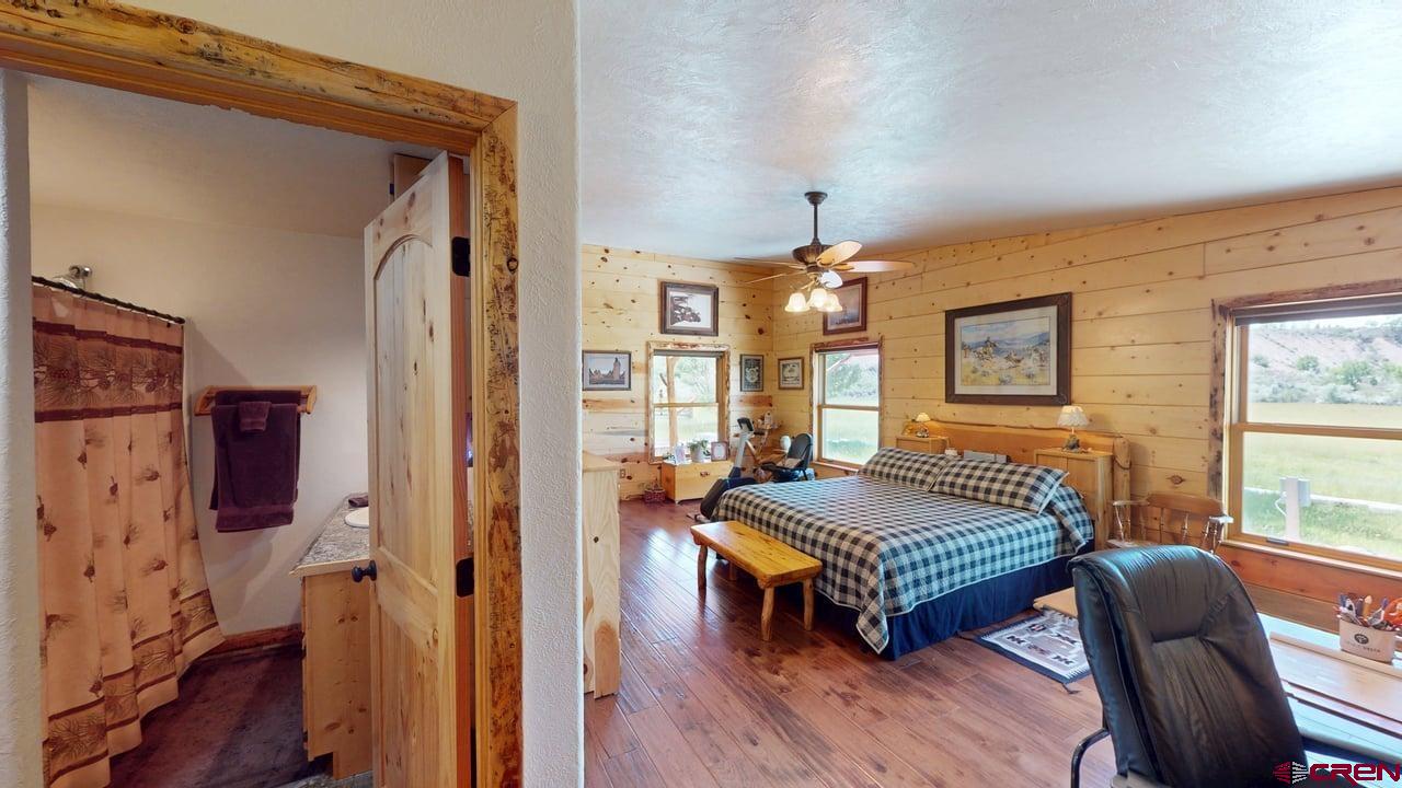11694 Trap Club Road Austin, CO 81410 - Photo 17 of 45 a living room with furniture and a wooden floor