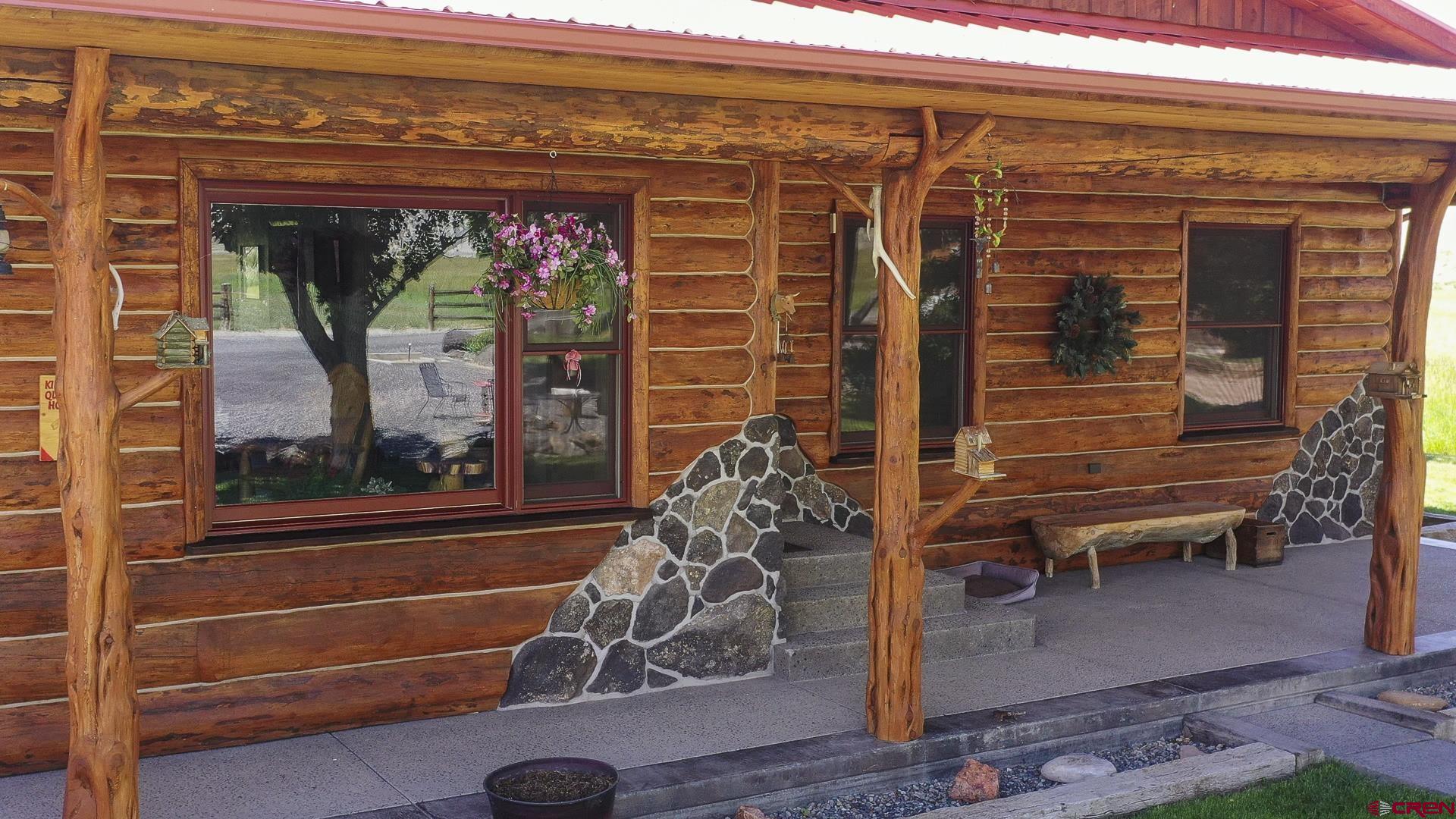 11694 Trap Club Road Austin, CO 81410 - Photo 18 of 45 a view of a porch with a table and chairs