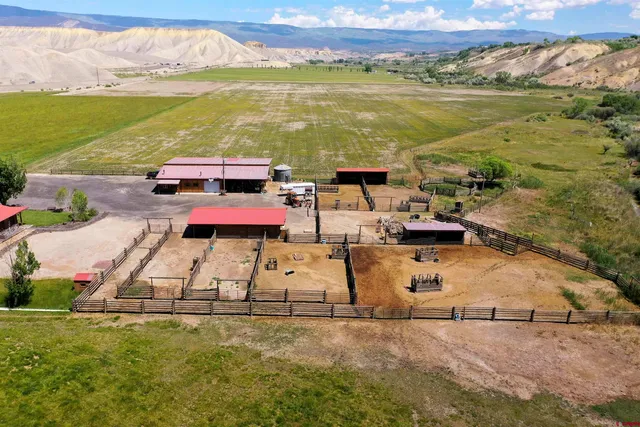 a view of a patio with two chairs and a table