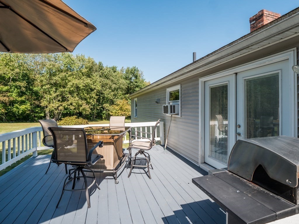 281 Brooks Station Road Princeton, MA 01541 - Photo 11 of 42 a view of balcony with furniture and wooden floor