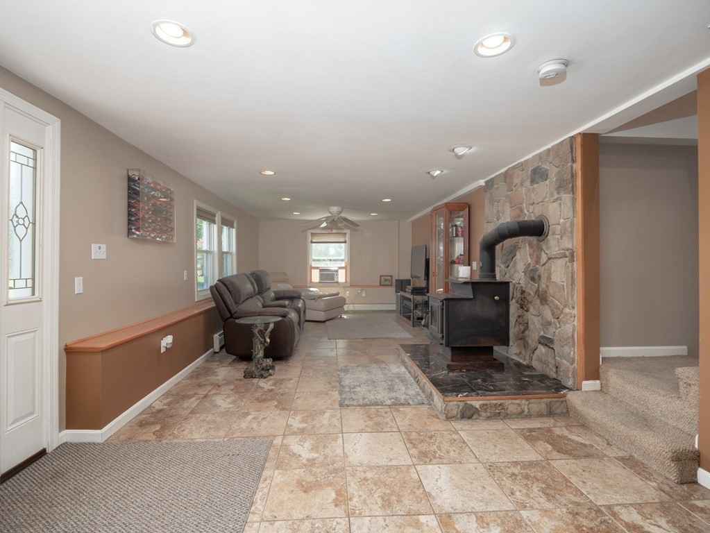 281 Brooks Station Road Princeton, MA 01541 - Photo 19 of 42 a living room with furniture and a table