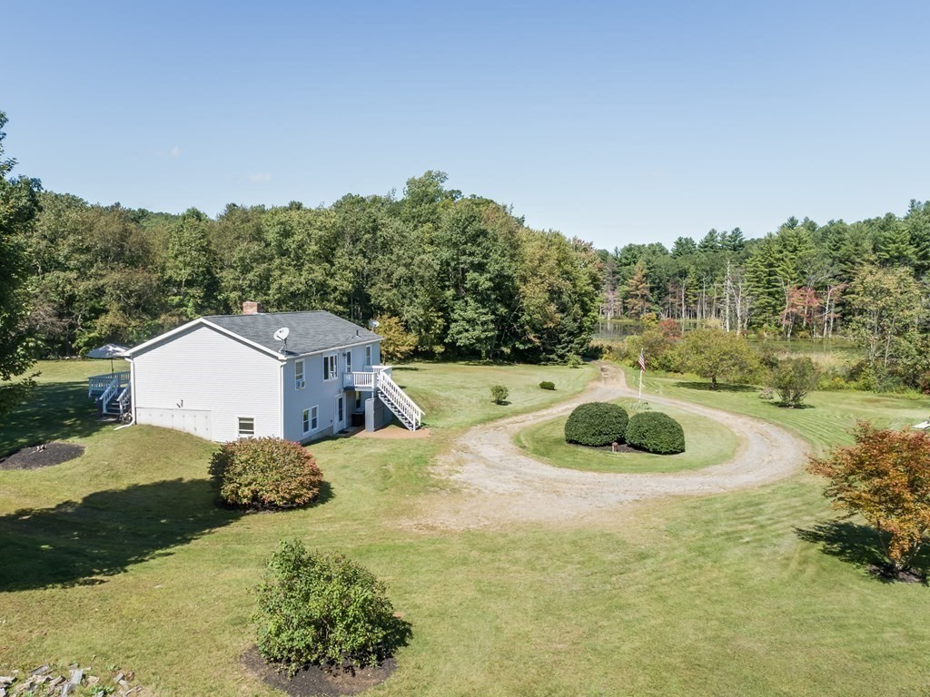281 Brooks Station Road Princeton, MA 01541 - Photo 33 of 42 a backyard of a house with a yard and lake view