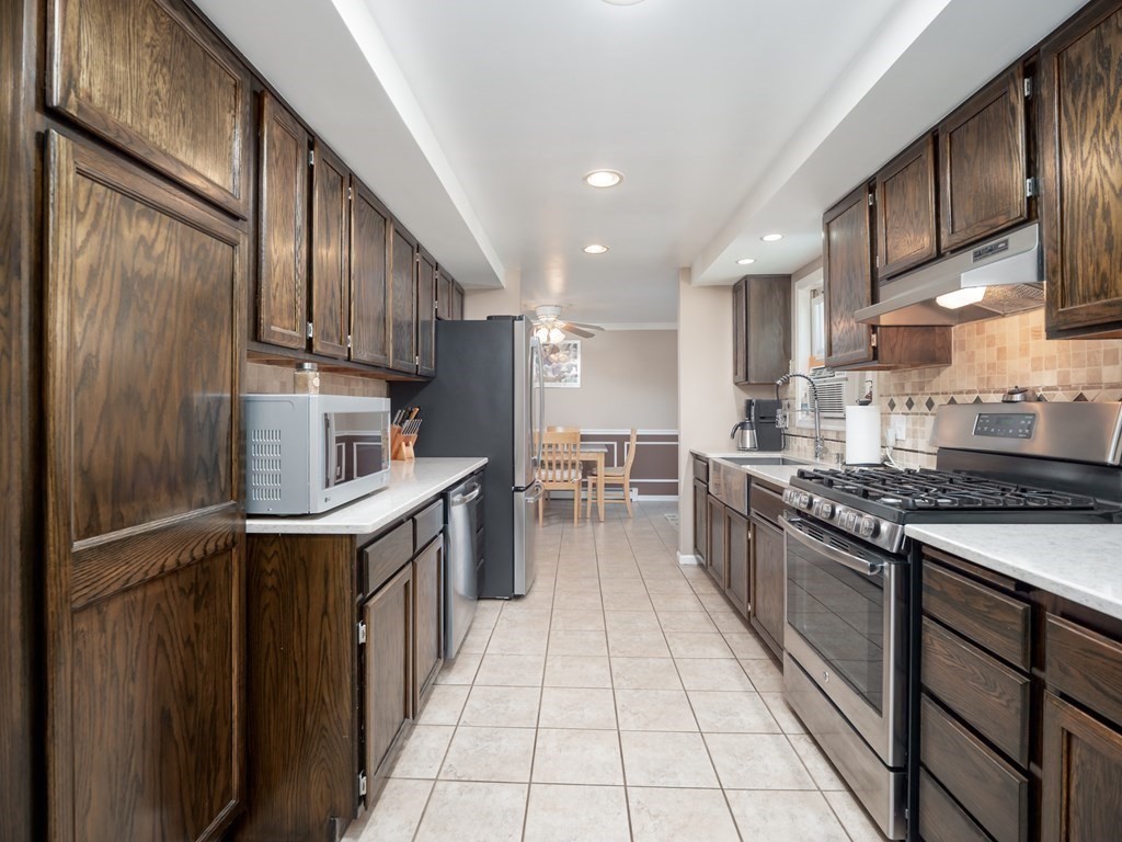 281 Brooks Station Road Princeton, MA 01541 - Photo 6 of 42 a kitchen with stainless steel appliances granite countertop a stove top oven a sink and a refrigerator