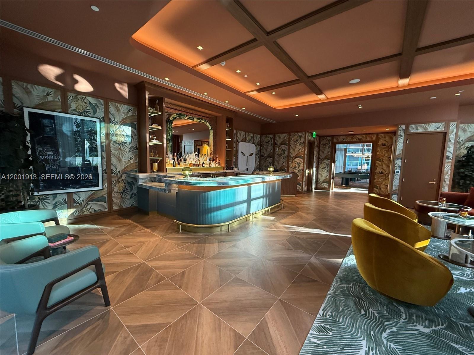 77 Southeast 5th Street, Unit 1007 Miami, FL 33131 - Photo 25 of 31 a outdoor space with the couches and dining table with the potted plants