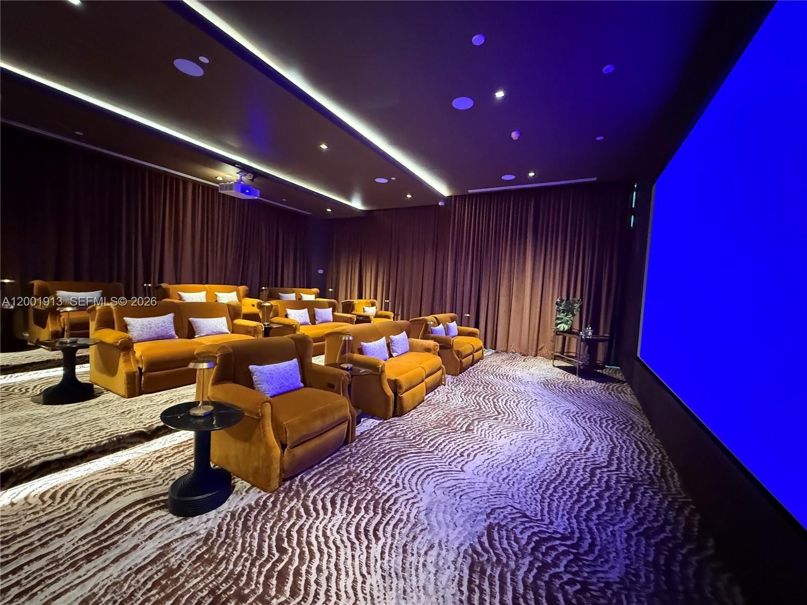 77 Southeast 5th Street, Unit 1007 Miami, FL 33131 - Photo 28 of 31 a group of people sitting on a roof deck