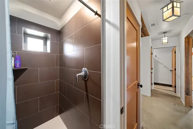 a living room with furniture and a dining table