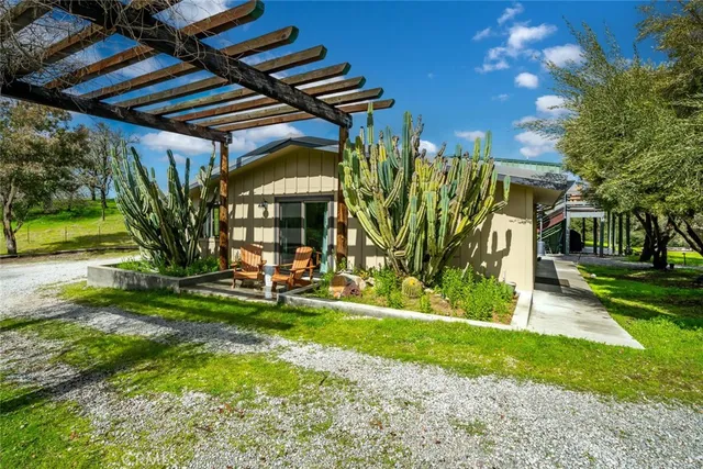 a bedroom with a bed and a flat tv screen on wall