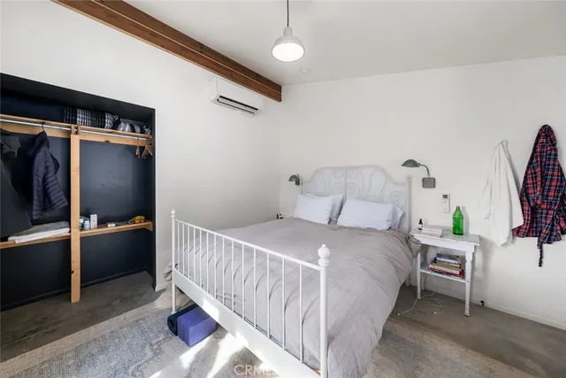 a dining room with furniture a floor to ceiling window and wooden floor