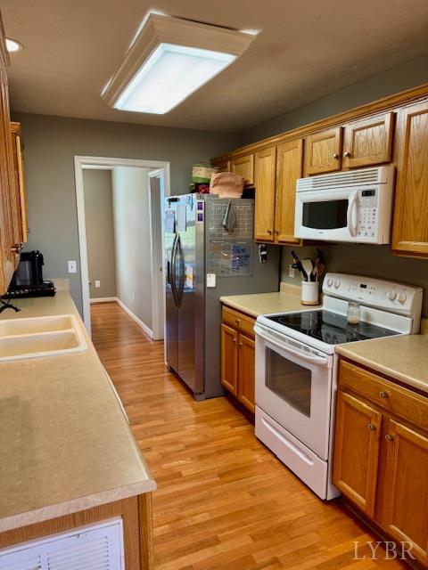 1351 Purdum Mill Road Appomattox, VA 24522 - Photo 11 of 28 a kitchen with stainless steel appliances a stove a sink and a microwave