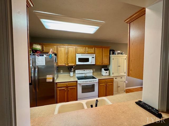 1351 Purdum Mill Road Appomattox, VA 24522 - Photo 12 of 28 a kitchen with stainless steel appliances granite countertop a refrigerator and a stove top oven