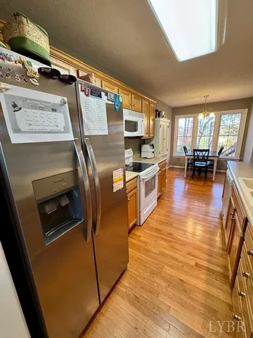 a kitchen with stainless steel appliances granite countertop a stove and a refrigerator