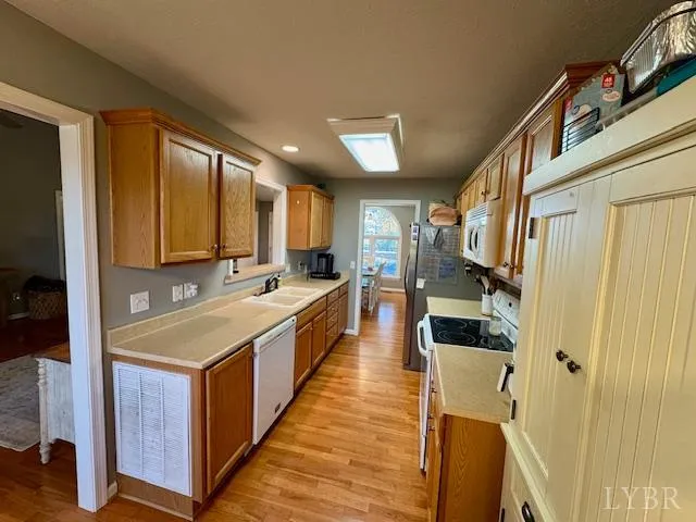 a large kitchen with a large window