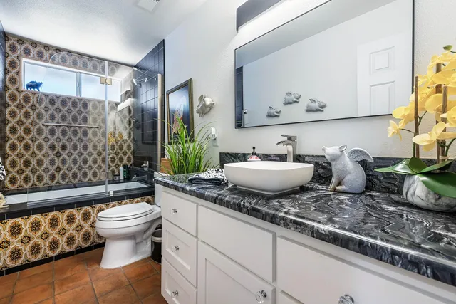 a bedroom with a bed and a walk in closet