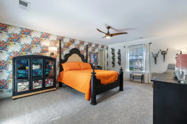 a bed room with a bed and a tv