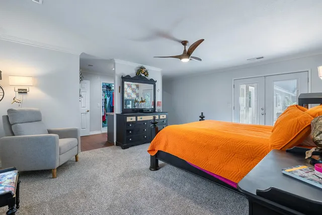 a view of walk in closet with clothes