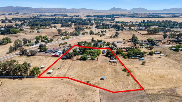 a dining room with furniture and a window