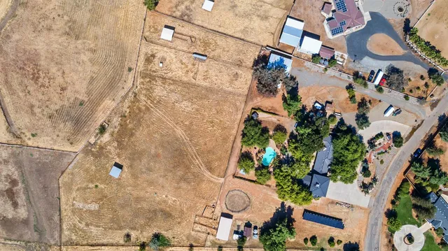 a kitchen with a refrigerator and a stove top oven