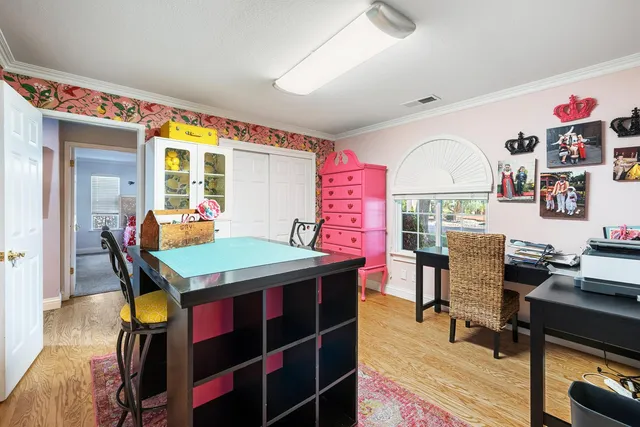 a view of a dining room with furniture and window