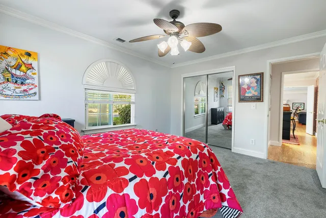 a bathroom with a granite countertop toilet sink and mirror