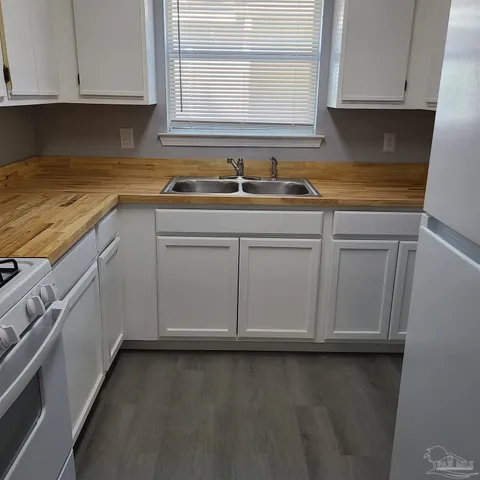 a kitchen with a sink and cabinets