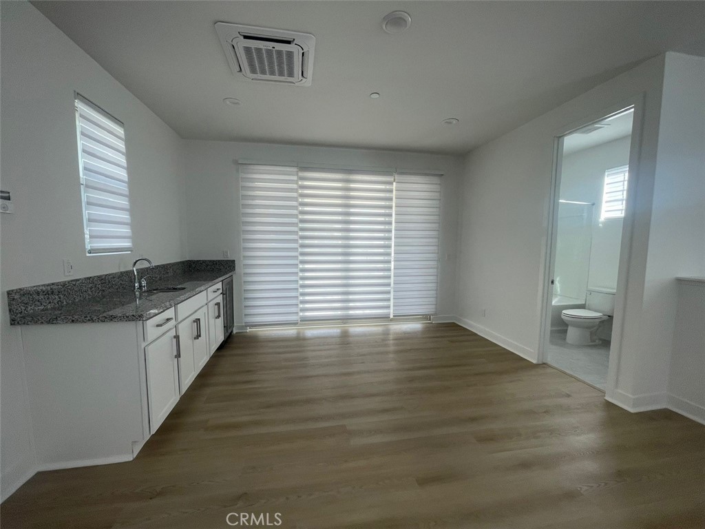 170 Episode Irvine, CA 92618 - Photo 37 of 63 a large white kitchen with granite countertop a large counter top and sink