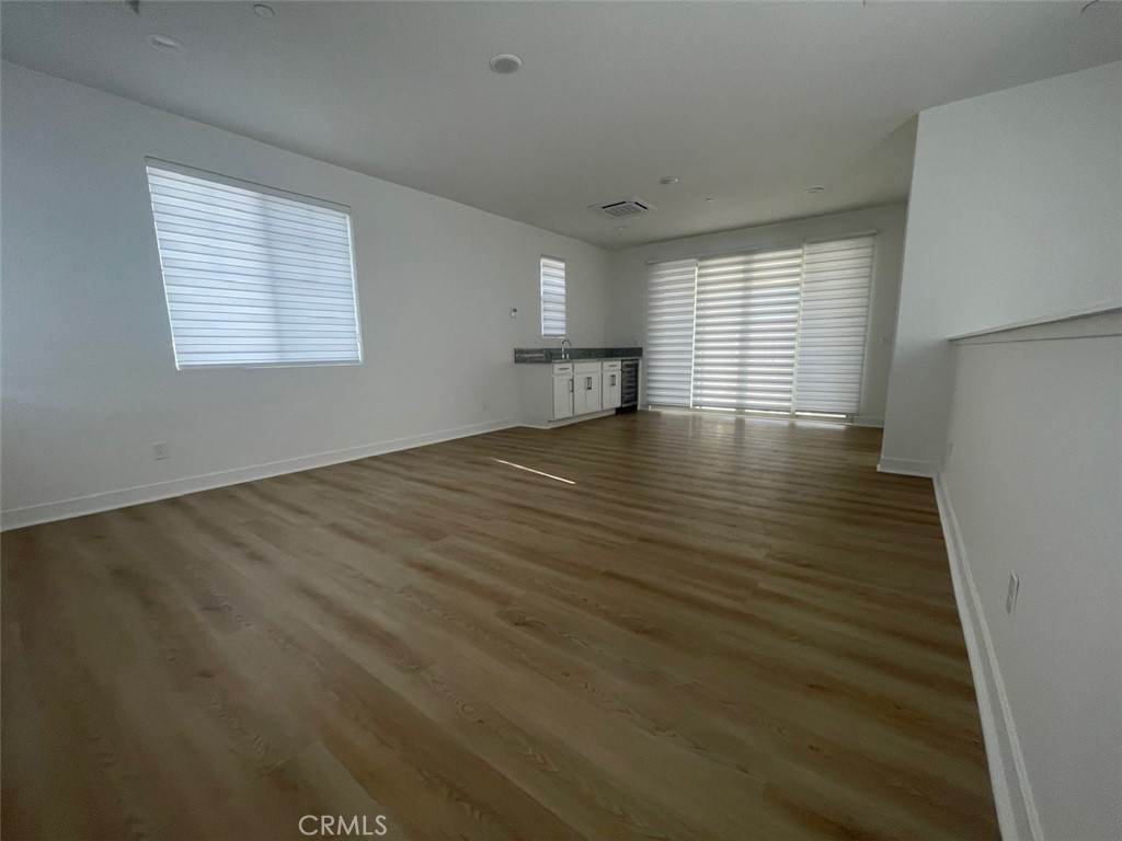 170 Episode Irvine, CA 92618 - Photo 39 of 63 an empty room with wooden floor and windows