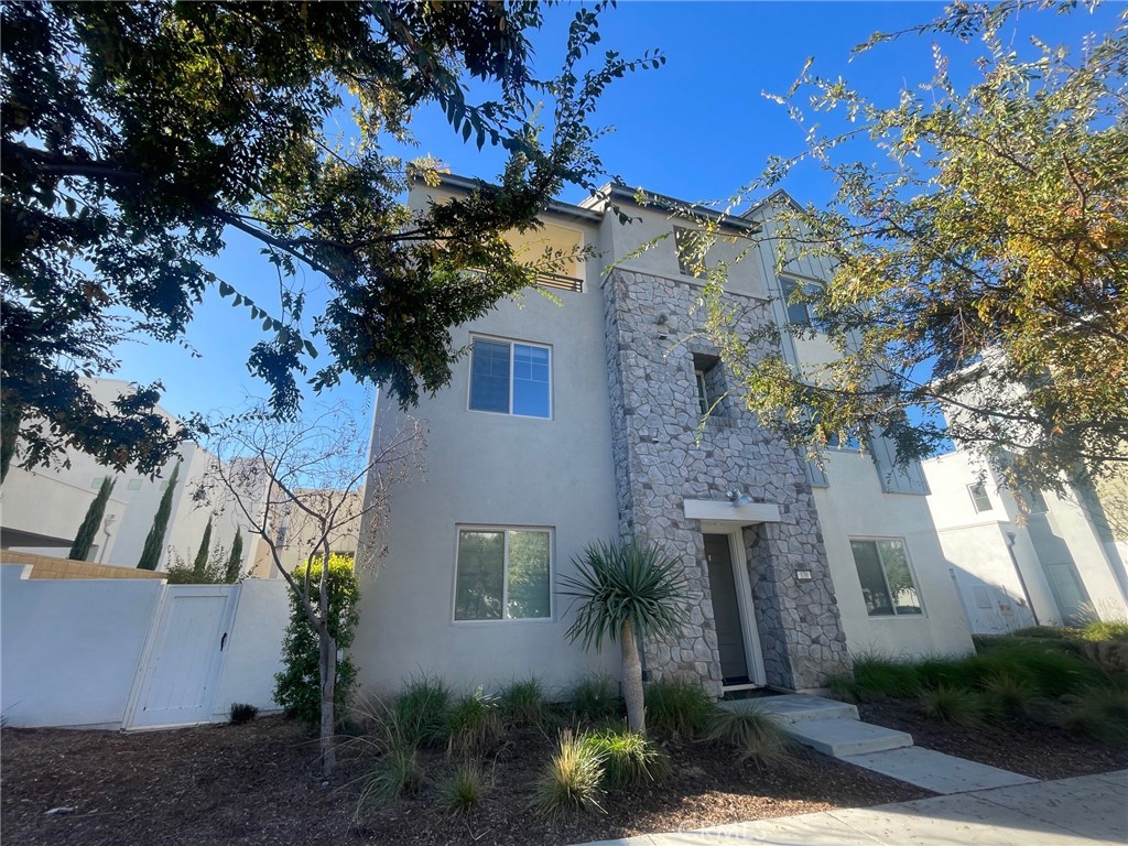 170 Episode Irvine, CA 92618 - Photo 59 of 63 a front view of a house with a yard