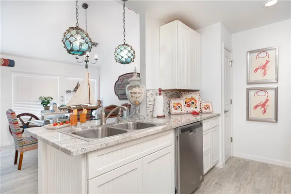 a view of a livingroom with furniture and staircase